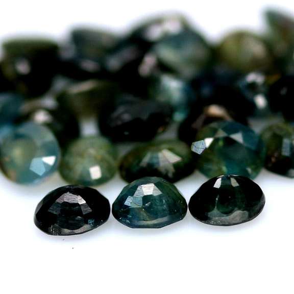 Heated only! 15.21ct blue green Sapphire set