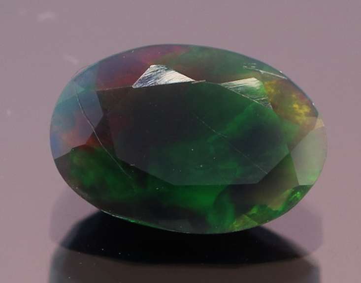 Fully faceted 1.34ct oval cut Black Opal