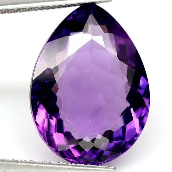 Pear cut 22.41ct royal purple created Amethyst