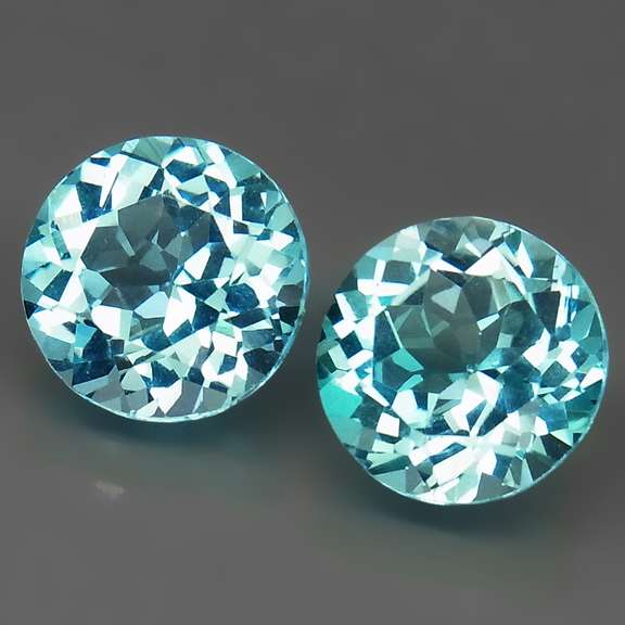 Eye clean 7.02ct round brilliant cut Topaz pair