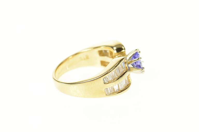 14K Yellow Gold 1.60 Ctw Oval Tanzanite Baguette Diamond Ring