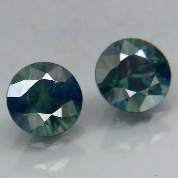 Unheated! .98ct diamond cut blue green Sapphire set