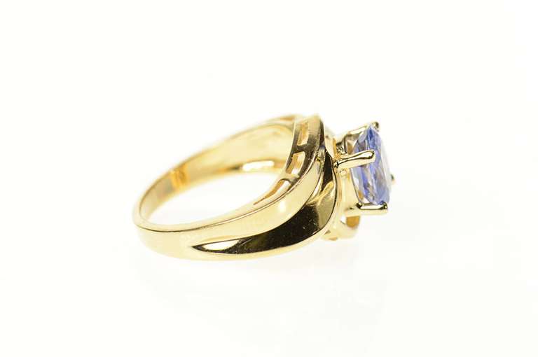 14K Yellow Gold Oval Tanzanite Solitaire Curvy Bypass Ring