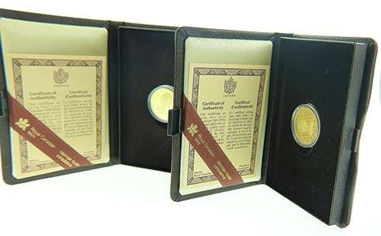 Two gold coins 1985 and 1986 Canadian 100 Dollar Commemorative Coins