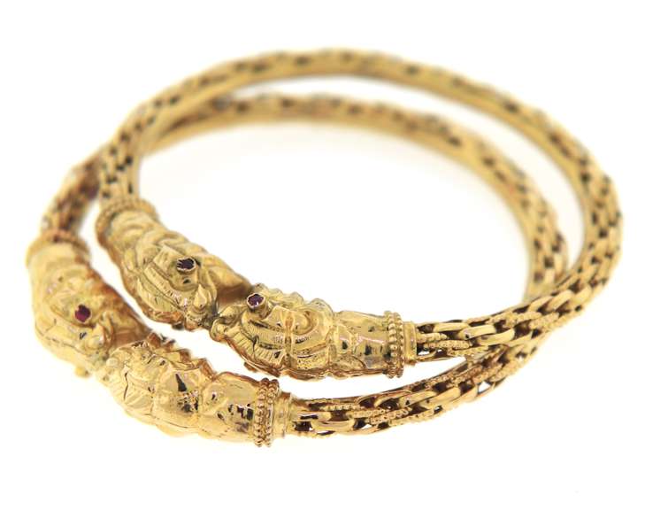 A pair of 21kt Yellow Gold Bangle Bracelets