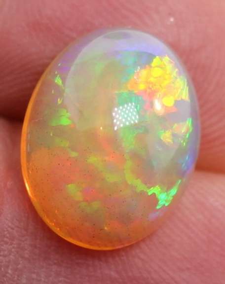 Phenomenal full spectrum flashing 4.68ct semi-black Opal