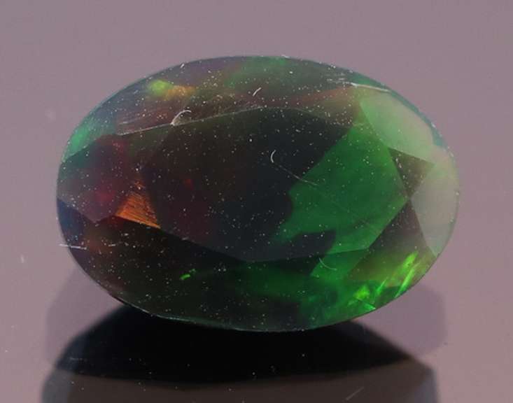 Fully faceted 1.34ct oval cut Black Opal