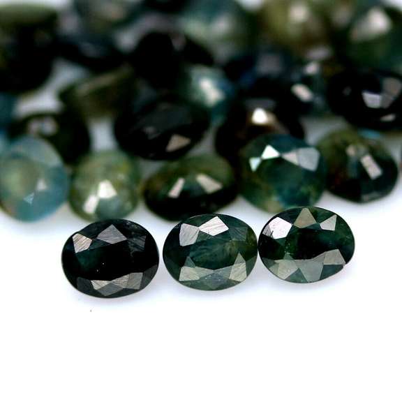 Heated only! 15.21ct blue green Sapphire set