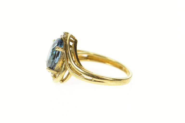 14K Yellow Gold Blue Topaz Diamond Accent Orante Bypass Ring