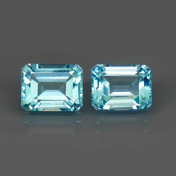 Eye clean 6.13ct vivid blue emerald cut Topaz set