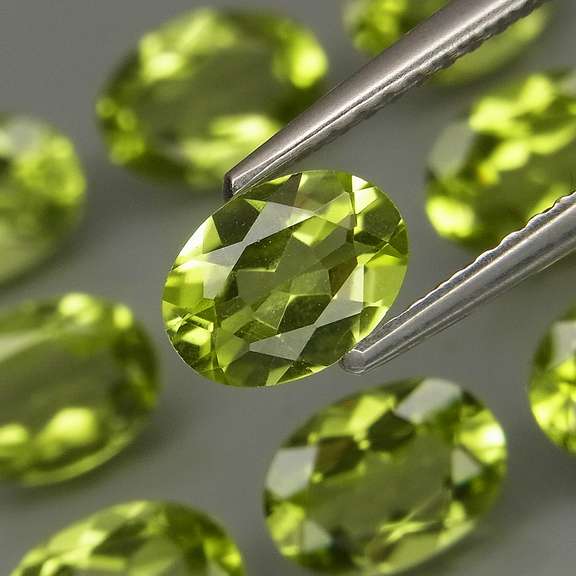 Dazzling 7.20ct untreated apple green Peridot set