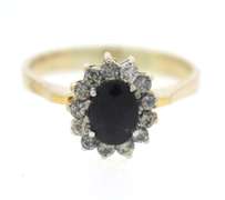 Stylish Yellow Gold Oval Sapphire & Round Diamond Halo Ring
