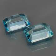 Eye clean 6.13ct vivid blue emerald cut Topaz set