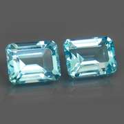 Eye clean 6.13ct vivid blue emerald cut Topaz set