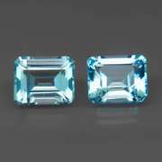 VS clarity 8.09ct vivid blue emerald cut Topaz set