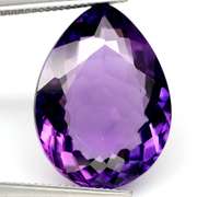 Pear cut 22.41ct royal purple created Amethyst