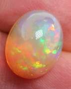 Phenomenal full spectrum flashing 4.68ct semi-black Opal