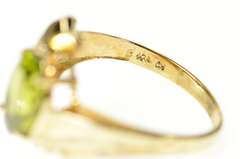 10K Yellow Gold Wavy Curvy Grooved Bypass Oval Peridot Ring