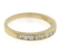 Elegant 14kt Yellow Gold Channel Set Diamond Band