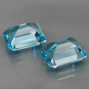 VS clarity 8.09ct vivid blue emerald cut Topaz set