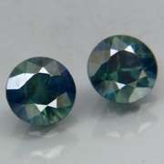 Unheated! .98ct diamond cut blue green Sapphire set