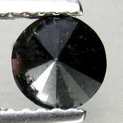 Very fine .62ct smooth cut Black Diamond solitaire