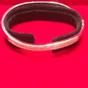 LADIES 14K WHITE GOLD AND DIAMONDS TWISTED DESIGN BANGLE BRACELET.