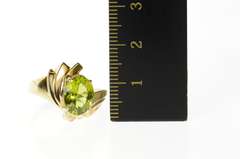 10K Yellow Gold Wavy Curvy Grooved Bypass Oval Peridot Ring