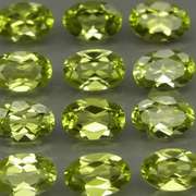 Dazzling 5.72ct untreated apple green Peridot set