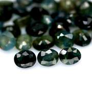 Heated only! 15.21ct blue green Sapphire set