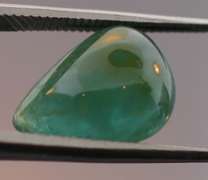 Eye catching 3.24ct forest green Grandidierite cabochon