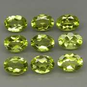 Dazzling 7.20ct untreated apple green Peridot set