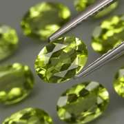 Dazzling 7.20ct untreated apple green Peridot set