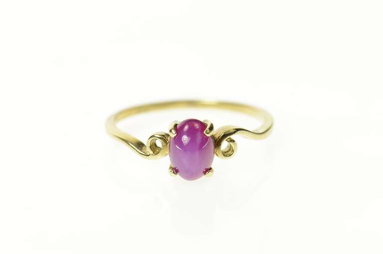 10K Yellow Gold Oval Syn. Pink Star Ruby Cabochon Swirl Ring