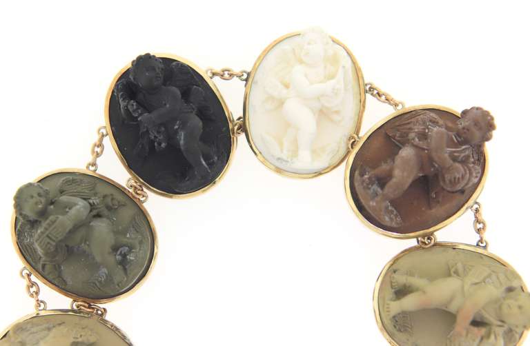 Memorable Seven Oval Shaped Bezel Set Lava Stones & Shell Cameos Bracelet