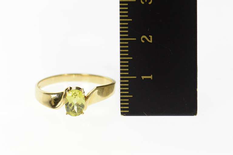 10K Yellow Gold Oval Peridot Solitaire Curved Design Simple Ring