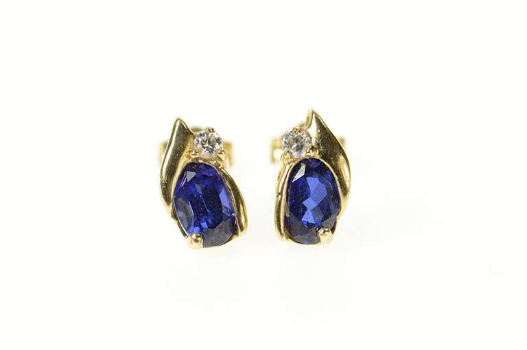 14K Yellow Gold Oval Syn. Sapphire CZ Accent Stud Earrings