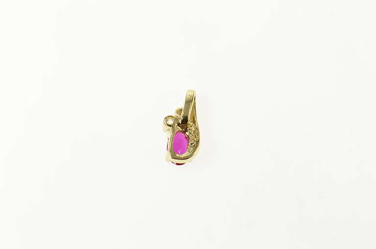 10K Yellow Gold Oval Syn. Ruby CZ Accent Simple Pendant