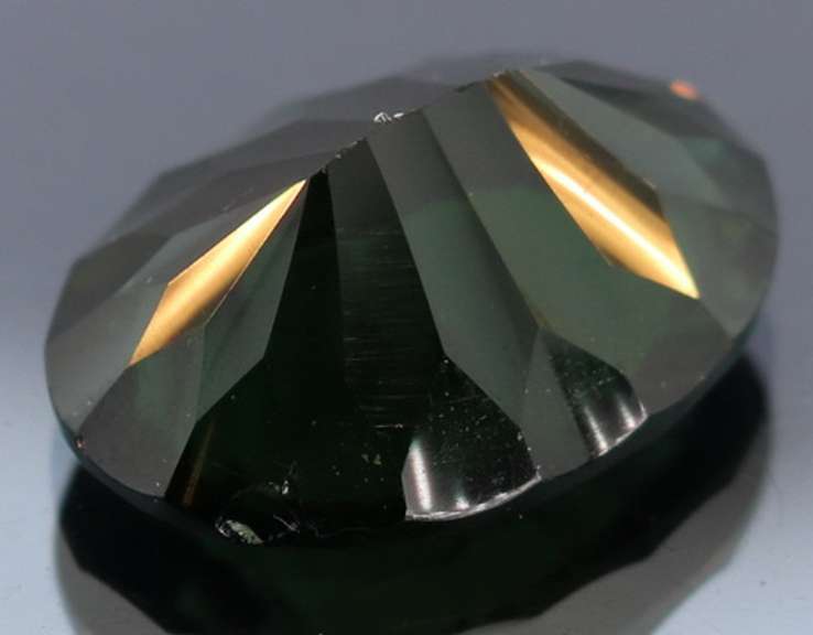 Unique 14.30ct greenish black created Amethyst