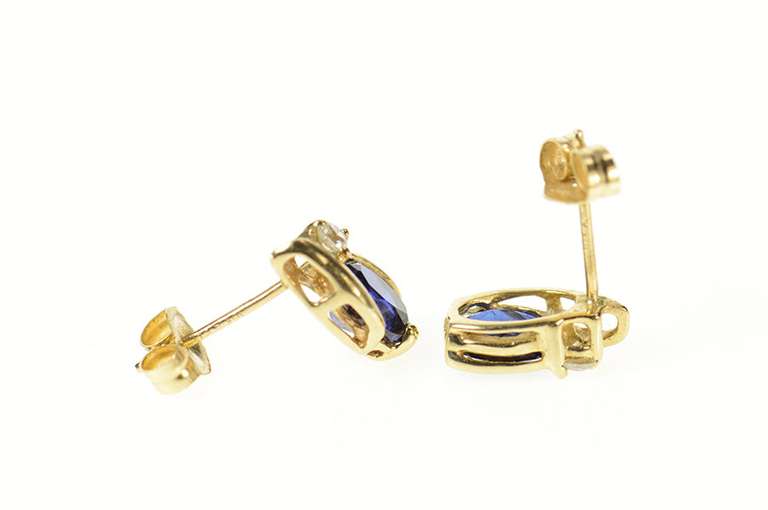 14K Yellow Gold Oval Syn. Sapphire CZ Accent Stud Earrings