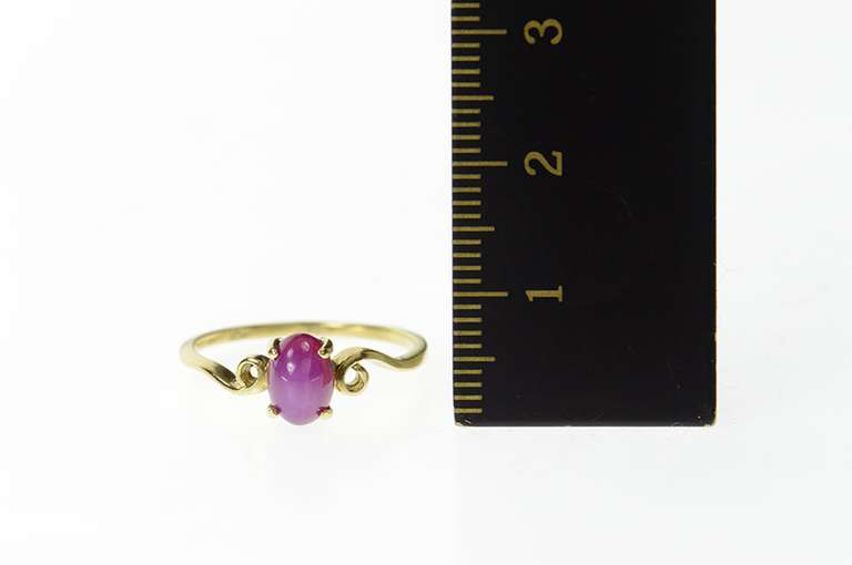 10K Yellow Gold Oval Syn. Pink Star Ruby Cabochon Swirl Ring