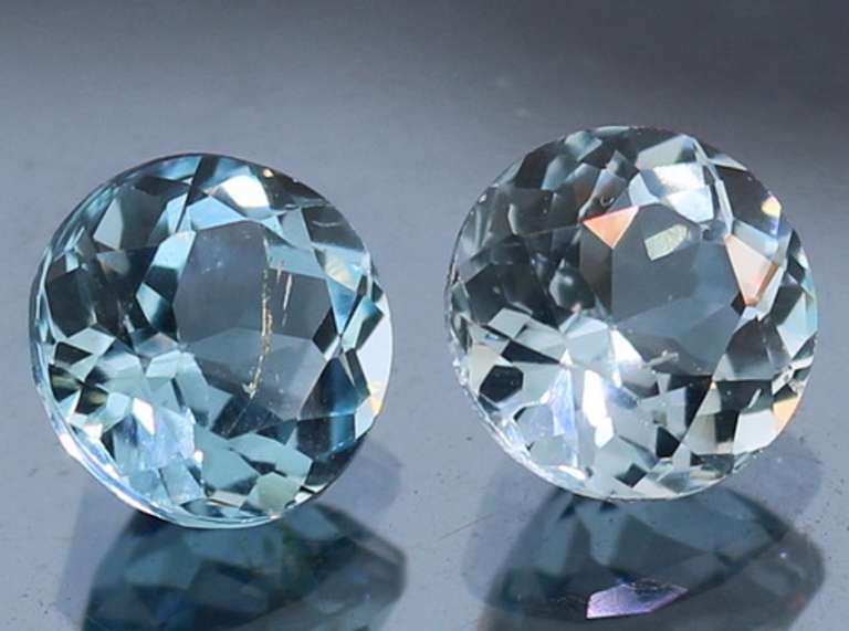 Heavy 5.02ct vivid sky blue Topaz set