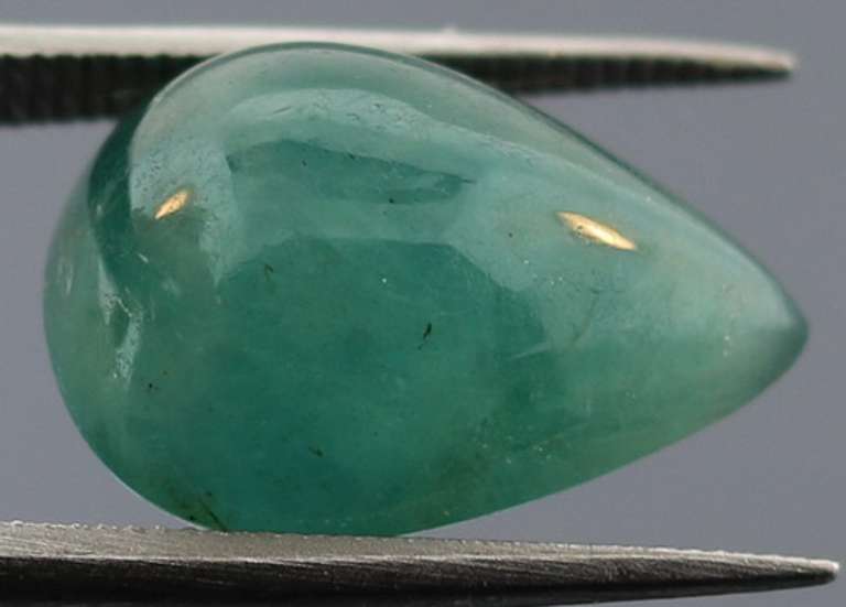 Eye catching 7.31ct blue green Grandidierite cabochon
