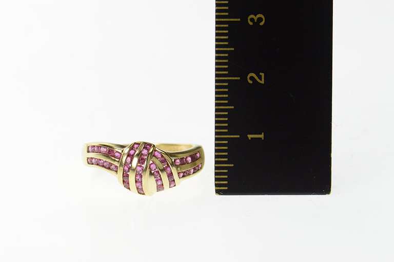 14K Yellow Gold Ruby Channel Knot Design Statement Ring