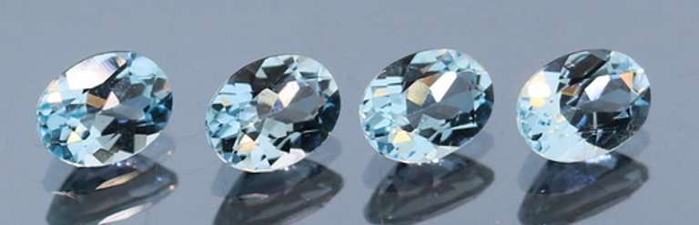 Heavy 5.88ct vivid sky blue Topaz set
