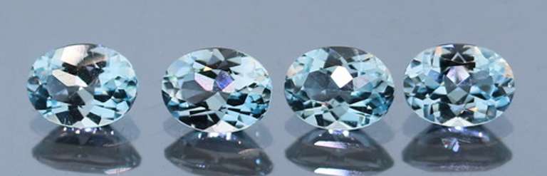 Heavy 5.88ct vivid sky blue Topaz set