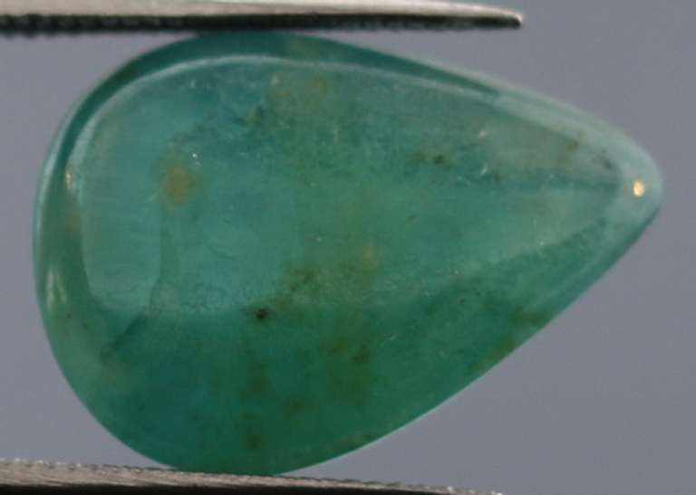Eye catching 7.31ct blue green Grandidierite cabochon