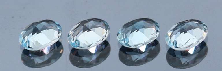 Heavy 5.88ct vivid sky blue Topaz set