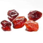 Heavy 27.97ct uncut Garnet set