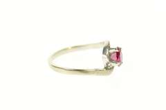 14K White Gold Round Syn. Ruby Solitaire Wavy Bypass Ring